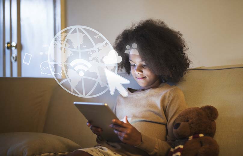 Young black girl using a digital tablet